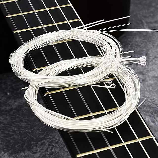 6 білих нейл. струн коробка та 3 мед. - класична гітара. Подарунок новачкові! - 3 фото товару