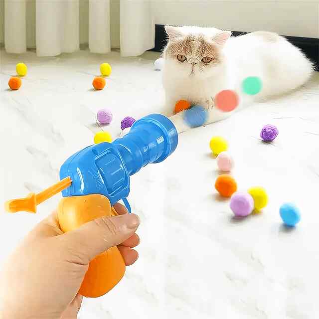 Іграшка-пістолет з плюшевими кульками для кішок та собак, активні ігри - 1 фото товару