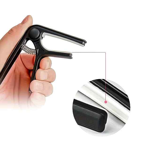 Каподастр для гітари, рожевий колір. Зміна тональності грифа інструмента. Компактний та зручний. Легкий АБС-пластик, комплект з 1шт. Україна. - 1 фото товару