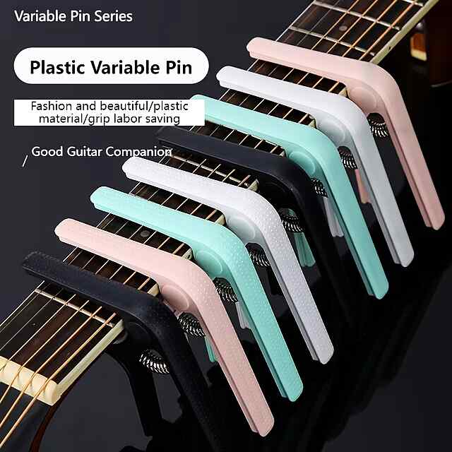 Каподастр для гітари, рожевий колір. Зміна тональності грифа інструмента. Компактний та зручний. Легкий АБС-пластик, комплект з 1шт. Україна. - 2 фото товару
