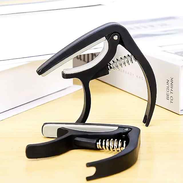 Каподастр для гітари, універсальний, чорний, АБС-пластик, 70г. - 0 фото товару